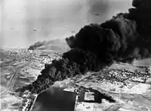 Image 53Smoke rises from oil tanks beside the Suez Canal hit during the initial Anglo-French assault on Egypt, 5 November 1956. (from Egypt)