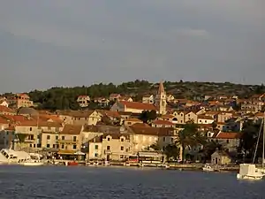 Port in Postira with church