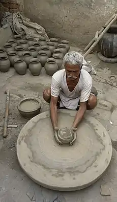 Potter at work, Jaura