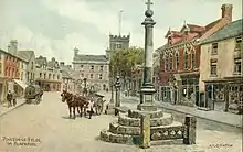 A c. 1920 postcard of Market Place, by A. R. Quinton. The building in the centre is no longer standing