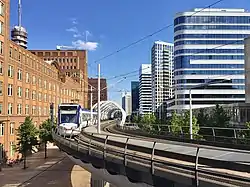 RandstadRail station Beatrixkwartier, nicknamed The 'Netkous' or Fishnet Stocking, with neighbouring skyscrapers