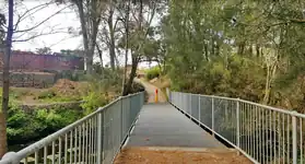 The pedestrian bridge over the creek