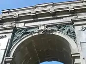 Detail of the work above the central arch of the Proyart war memorial