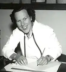 Photograph of Dr Prue Barron at her desk