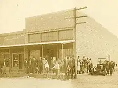 The cement block building that replaced J.J. Putnam's first general merchandise store, which burned, on the southeast corner of Pickens Road and Curtis Avenue in 1914.