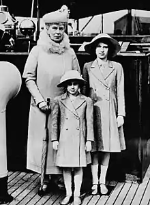 Elderly Mary and the two girls in formal dress