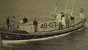 RNLB Ruby and Arthur Reed (ON 990). A photograph of the lifeboat taken during a launch from Cromer Station