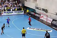 Gergö Ivancsik executing a 7m throw against Romanian keeper Rudi Stănescu in an EHF Champions League game between KC Veszprém and HCM Constanţa