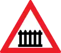 Level crossing with gates or barriers ahead