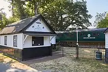 Photograph of a train carriage at a disused station