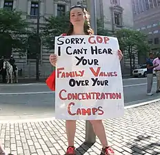 A protester compares child detention by the government to the Nazi concentration camps