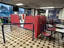 Photograph of the interior of a restaurant with seating