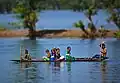 Children in a boat on the Shari-Goyain River in Ratargul Swamp Forest