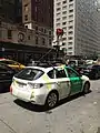 The cameras of this Google Street View car are mounted on the roof rack. The power and data cables are fed into the car through the right rear passenger window.