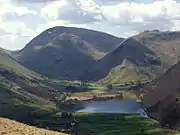 Red Screes and Middle Dodd seen beyond Brothers Water from the Patterdale Valley. On the right is High Hartsop Dodd.