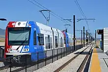 A light-rail train at the Daybreak Parkway station