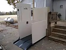 Residential Wheelchair Lift installed against raised deck