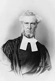 Full front head and shoulders portrait of the Reverend John Gardner (1809-1899), Presbyterian minister. He is wearing preaching bands attached to his clerical collar.