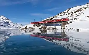 RhB EMUs ABe 4/4 III 55 "Diavolezza" and 54 "Hakone" cross the "Am See Brücke"