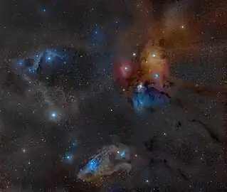 The large multicoloured Rho Ophiuchi cloud complex with the Dark River clouds (or Rho Ophiuchi Streamers) as Barnard 44 and 45 on the right, seemingly radiating towards the distant Pipe Nebula and the Galactic Center, extending from the core L1688 as well as L1689 dark nebulae. In the lower part of this wide field image the distinct blue eyed (Nu Scorpii) Blue Horsehead Nebula can be seen. The blue area at the back of the head is IC 4601. The cloud in the top left corner is LBN 1093 and Sh2-1 with the bright star being Pi Scorpii and the yellowish cloud in the middle on the left being Sh2-7 with Dschubba at its center.