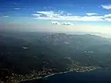 Aerial view of Attavyros area. The coastal settlements are Mandriko (left) and Kameiros Skala (right). On the hill upon K. Skala is visible Kritinia