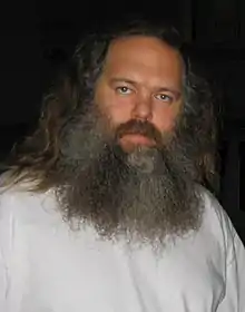 A white man with a long, grey beard