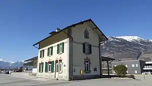 Three-story building with gabled roof