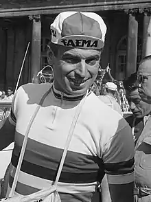 Rik Van Looy wearing a cycling cap with Faema insignia and a white cycling jersey with horizontally rainbow stripes across the chest