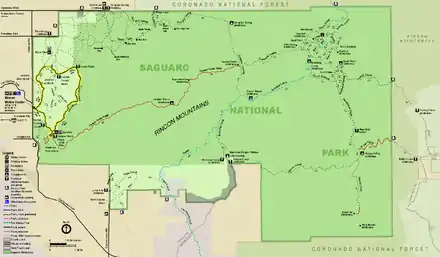 Map of the Rincon Mountain District, an irregular retangle, wider than long, colored green, and surrounded by areas colored brown or light purple that are outside the park