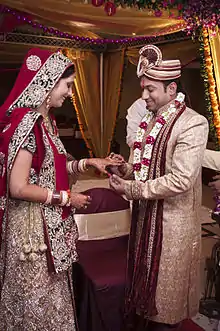 A north Indian bride and groom in their traditional attire.