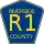 County Road R1 marker