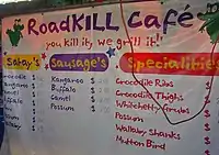 Roadkill Cafe at the Mindil Beach Sunset Markets in Darwin, Australia, carrying the motto "You kill it, we grill it "