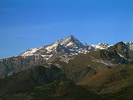 Snow-capped mountain against a blue sky