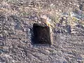 Rock cut cistern at Gudiwada Dibba