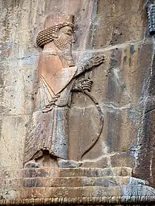 Stone relief of monarch, facing right