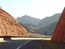 I-15 southbound at milepost 17.8—afternoon sun in a bright red rock cut