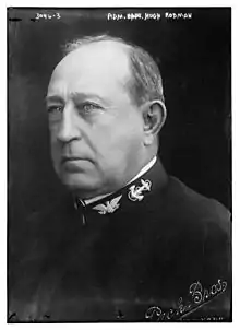 A balding man in his naval uniform