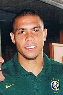 Portrait view of Ronaldo wearing a polo shirt, taken indoors