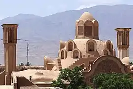 The dome of the talar and the two windcatchers on the house's roof.