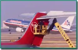 Maintenance being performed on a DC-9's tail section