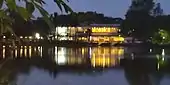 Reflections of the rowing clubs around the lake at night