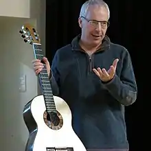 Image of Roy Courtnall Summerfield holding a guitar.