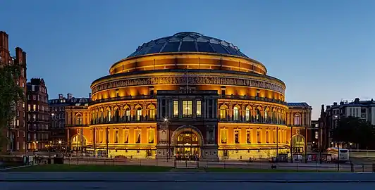 Image 12Royal Albert HallPhotograph: David IliffThe Royal Albert Hall is a concert hall, seating a maximum of 5,272, on the northern edge of South Kensington, London. Constructed beginning in 1867, the hall was inaugurated on 29 March 1871. Since 1941 it has held The Proms, an eight-week summer season of daily orchestral classical music concerts and other events.More selected pictures