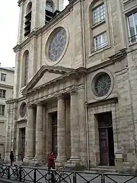 Portal with fronton and three rose windows