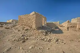 Ruined houses in Al Jumail.