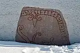 Runestone immured in the church porch