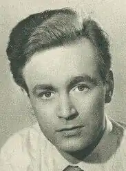 A 28-year-old man with brown hair looking into the camera.