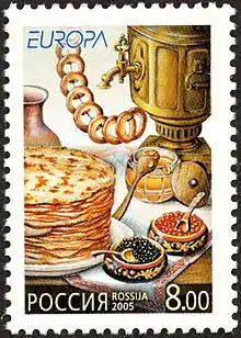 Russian stamp with blini and other motifs of Russian culture