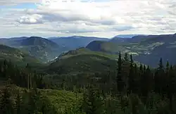 View over Begnadalen from Lærskogen, with the large woodland ranging all over to Randsfjorden on the left and Hedalsfjella in the right background.