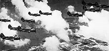 US Navy VFA-14's Curtiss SB2C Helldiver over Tinian in 1947, before base closure